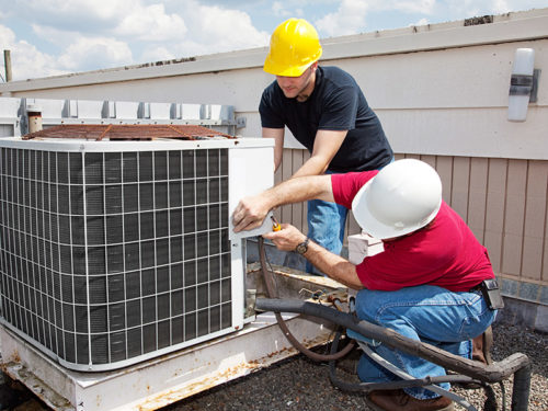 hvac technicians repairing air conditioner unit plantation fl